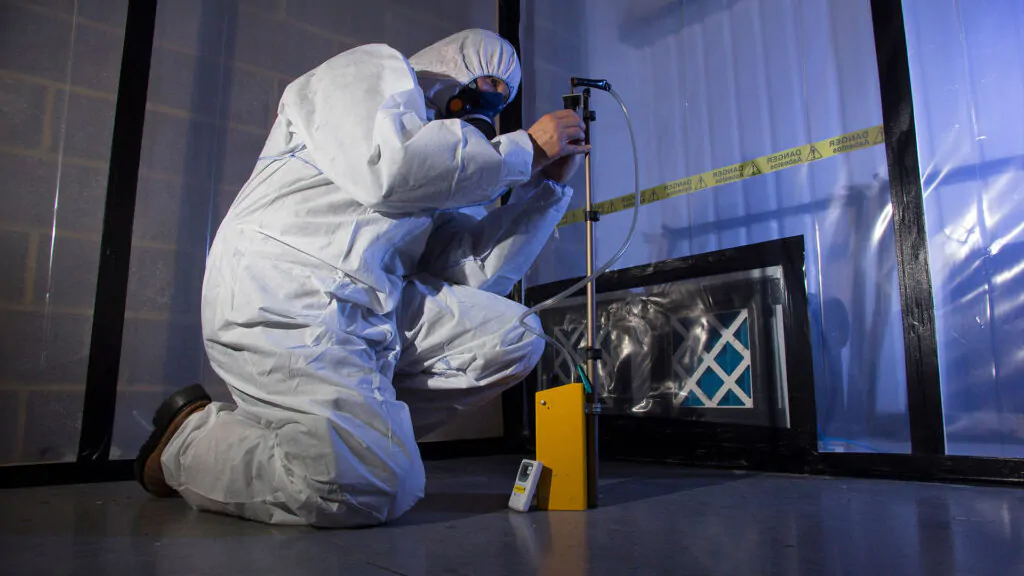 Laboratory technician analyzing asbestos samples